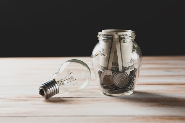 Premium Photo | Savings bank and light bulb