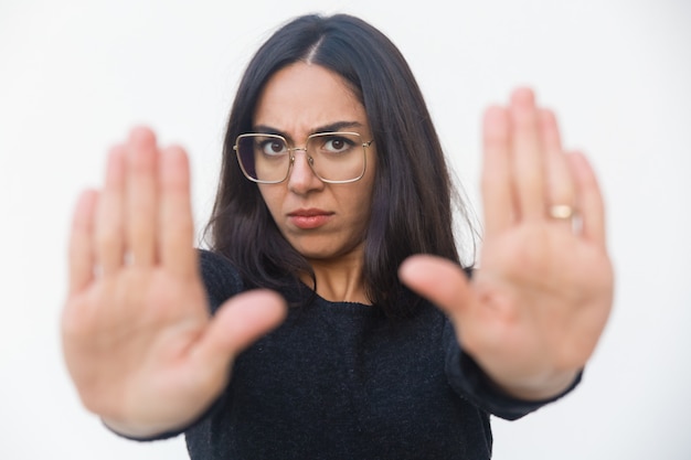 Scared upset woman making stop gesture Free Photo