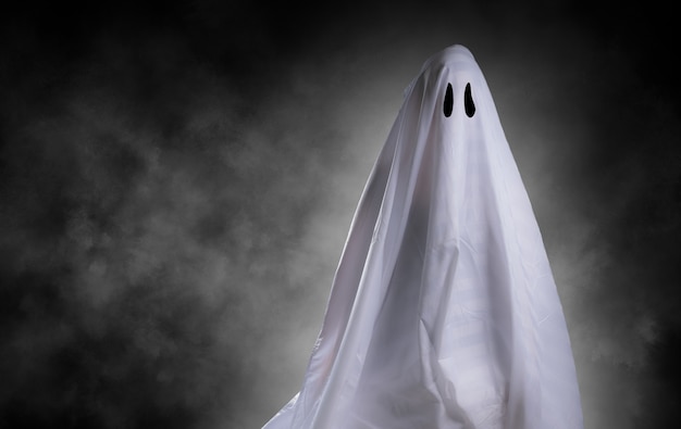 Premium Photo | Scary white ghost at big eye for halloween concept with ...