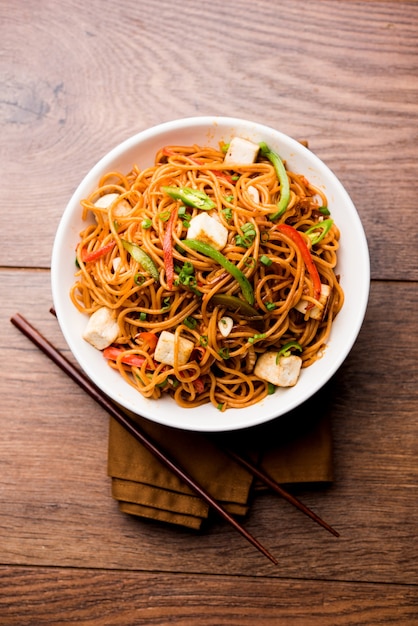 Premium Photo | Schezwan hakka noodles with paneer or cottage cheese ...