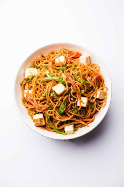 Premium Photo | Schezwan hakka noodles with paneer or cottage cheese ...