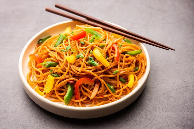 Premium Photo | Schezwan noodles or szechwan vegetable hakka noodles or ...