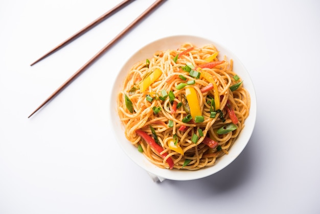 Premium Photo | Schezwan noodles or vegetable hakka noodles or chow ...