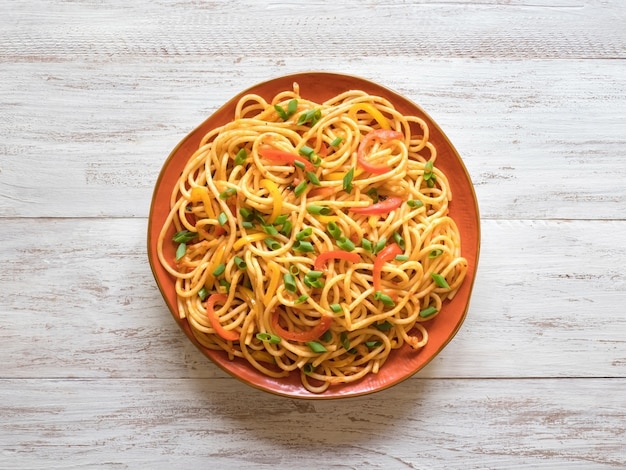 Schezwan noodles with vegetables in a plate Premium Photo