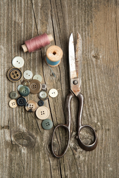 Premium Photo | Scissors and buttons