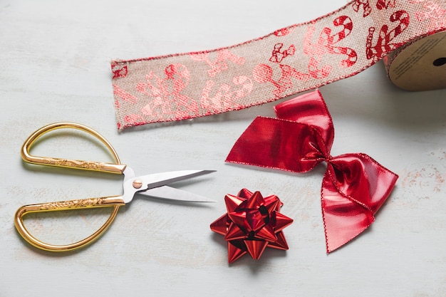 scissors-near-red-bows-christmas-ribbon_23-2147961642.jpg