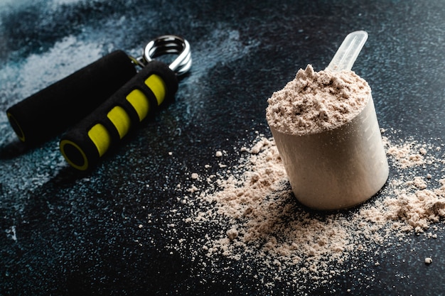 Premium Photo | Scoop of whey protein in . sport nutrition.