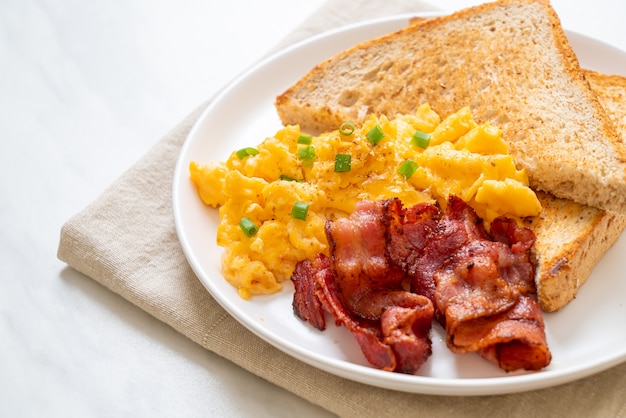 Premium Photo Scrambled Egg With Bread Toasted And Bacon For Breakfast