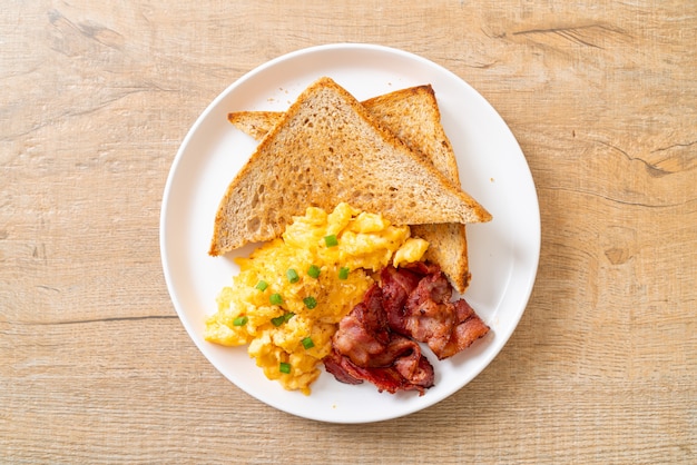 premium-photo-scrambled-egg-with-bread-toasted-and-bacon-for-breakfast