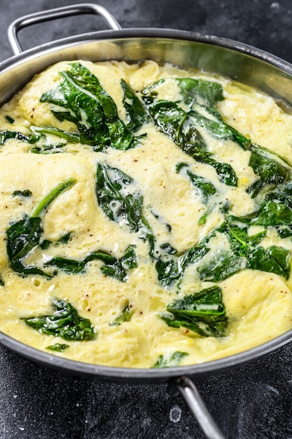 Premium Photo Scrambled Eggs With Spinach And Parmesan Cheese