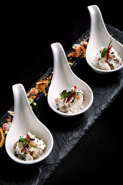 Premium Photo | Sea bass ceviche mini portions served in beautiful ...