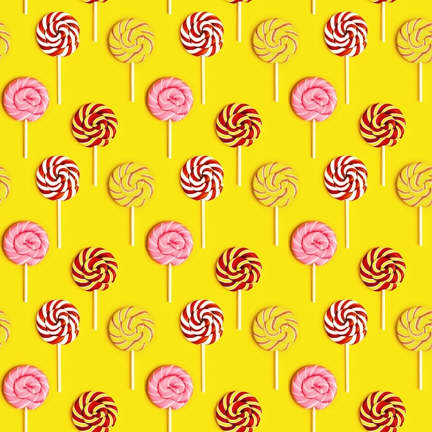 Seamless pattern with sweet round candy lollypops with stripes on stick Premium Photo
