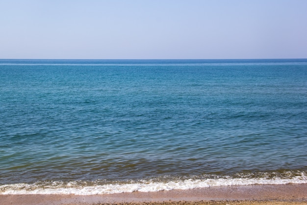 Premium Photo | Seascape of sand shore and waves of black sea