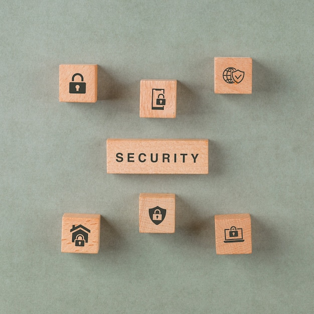 Security concept with wooden blocks with icons. Free Photo