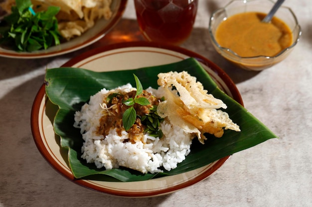 Premium Photo | Sego pecel tumpang, traditional breakfast with rice ...