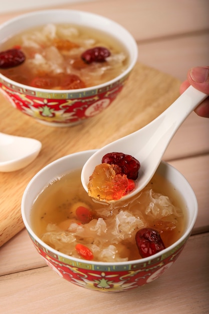 Premium Photo Selected Focus Peach Gum Triple Collagen Dessert Chinese Traditional Refreshment Beverages Contains Peach Gum Bird Nest Red Dates Snow Fungus Goji Berry Pandan Leaves And Rock Sugar