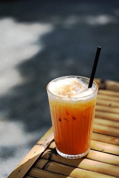 Premium Photo | Selective focus a glass of thai orange milk tea with ...