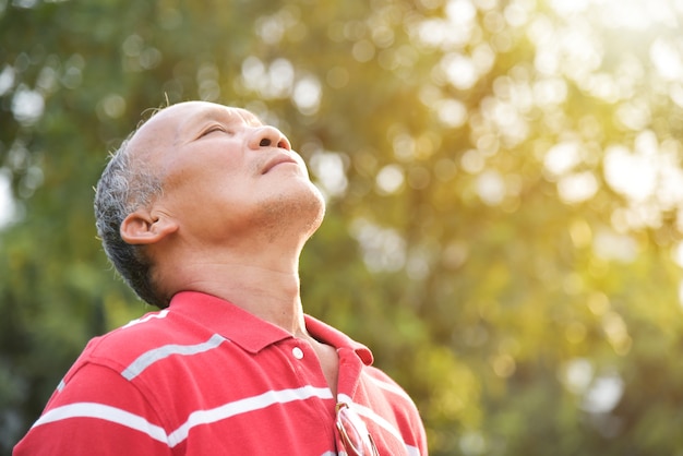 Premium Photo | Senior male breathing fresh air.