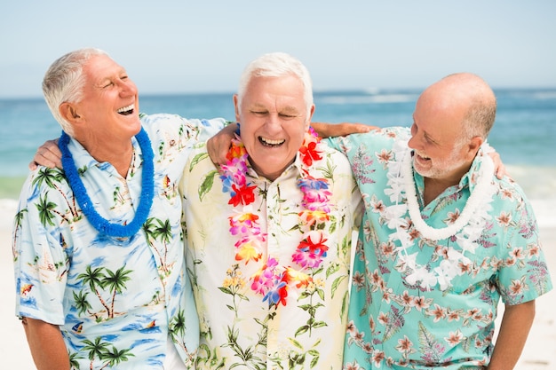 Senior men standing at the beach Premium Photo