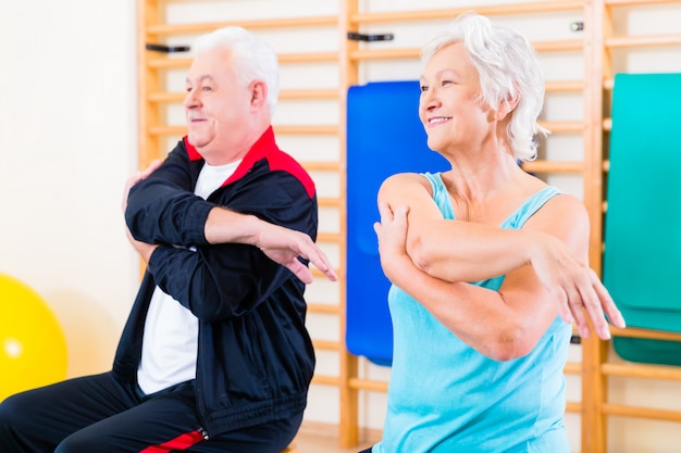 Premium Photo | Senior people in fitness exercise