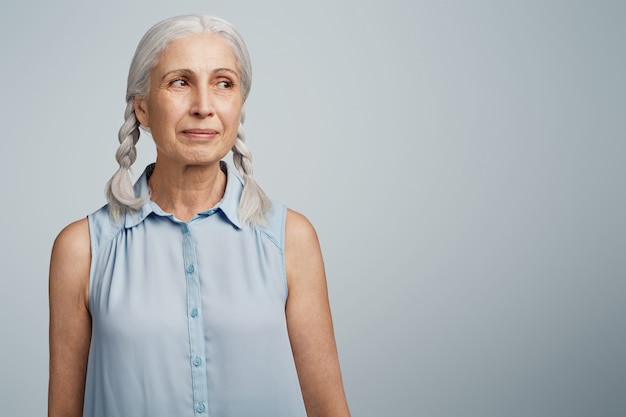 Free Photo | Senior woman with pigtails dressed in blue blouse