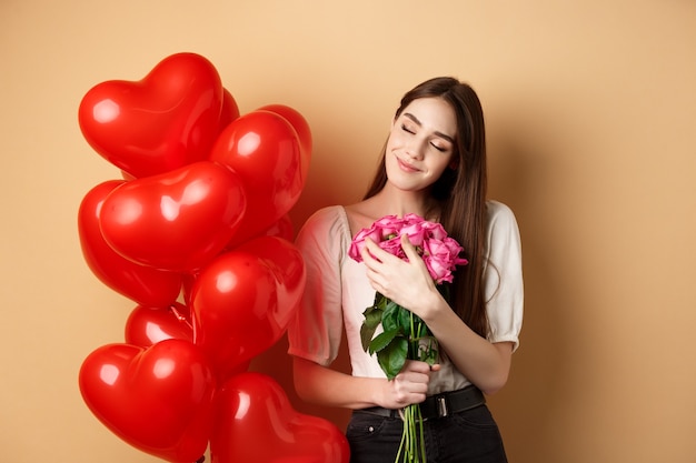 Premium Photo Sensual And Romantic Girl Hugging Bouquet Of Pink Roses