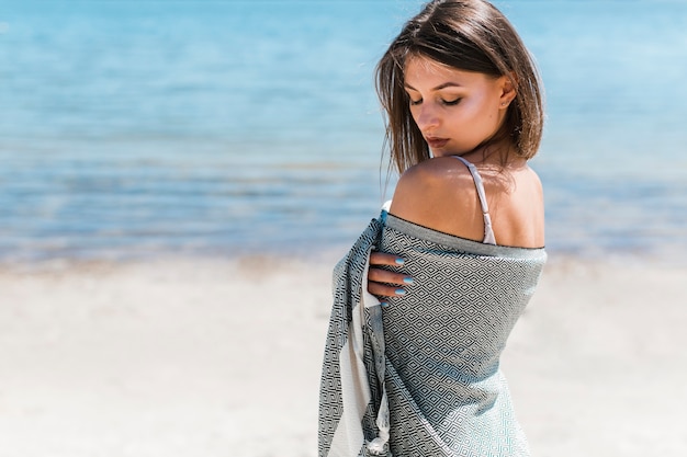 Sensual woman in gray scarf on beach Free Photo Sensual woman in gray scarf on beach Free Photo