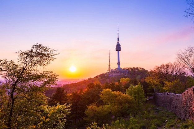 Premium Photo | Seoul tower in sunset and old wall on namsan mountain