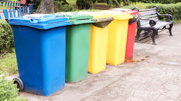 Premium Photo | Separate containers for garbage collection in the park ...