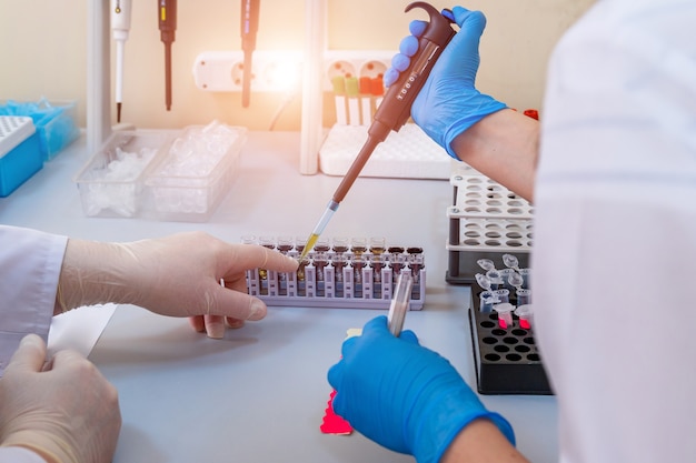 Premium Photo | Serious clinician studying chemical element in ...