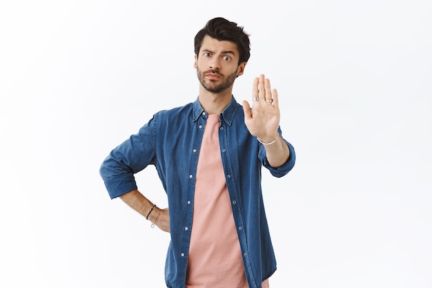 Premium Photo | Serious-looking concerned and assertive handsome man ...