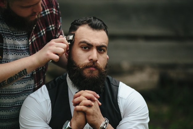 Serious man while shaving him Free Photo