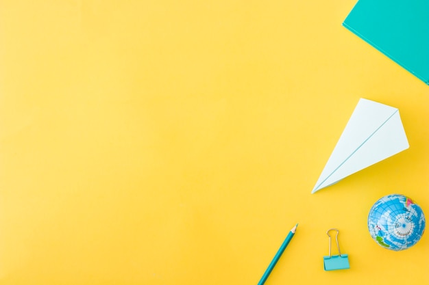 Set of accessories laying on yellow background Free Photo