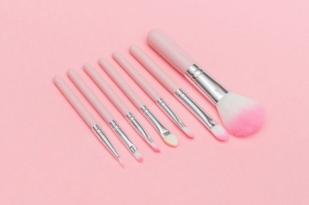 Premium Photo Set Of Pink Makeup Brushes On Pastel Pink Background