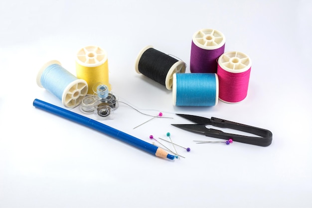 Premium Photo | Sewing tools and accessories with colorful threads on ...