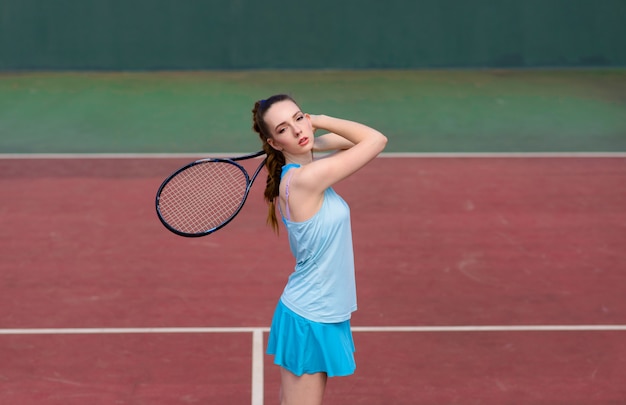 Premium Photo Sexy Girl Tennis Player Holding Tennis Racket On The Court