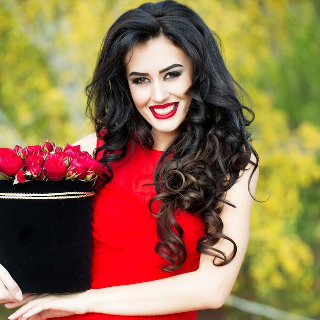 Premium Photo | Sexy smiling girl with red roses