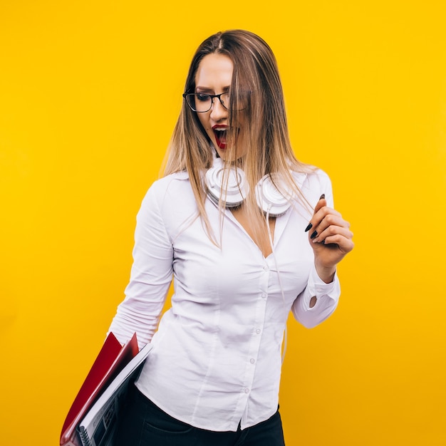 Premium Photo Sexy Teacher On A Yellow Wall 