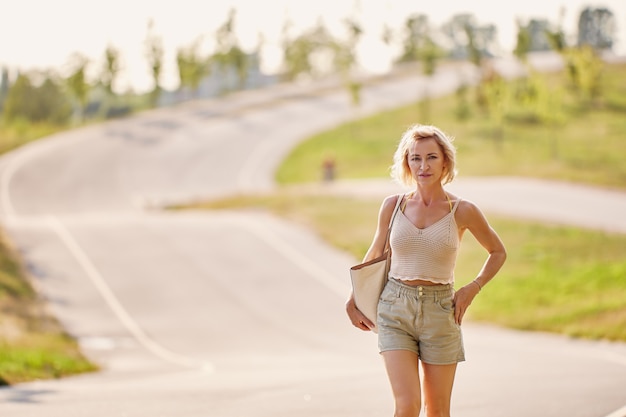 Premium Photo Sexy Year Old Woman Dressed In Shorts And Sleeveless