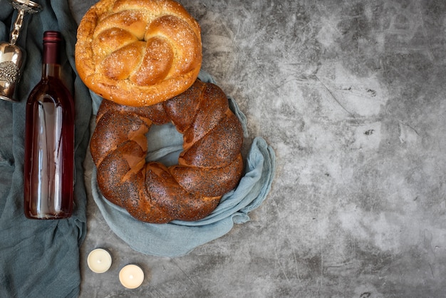 Premium Photo | Shabbat shalom - challah bread, shabbat wine and ...