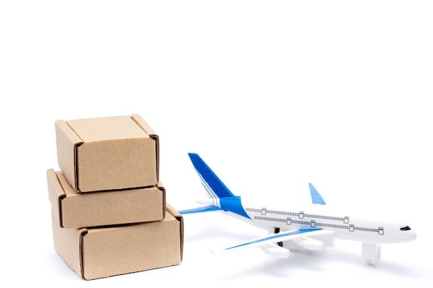 Premium Photo | Shadow airplane and stack of cardboard boxes isolated ...