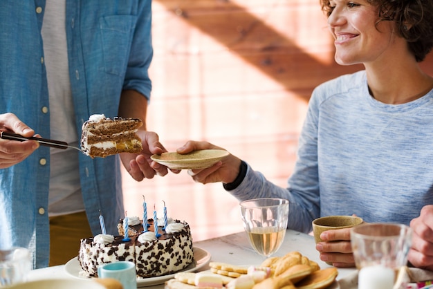 Sharing birthday cake | Free Photo
