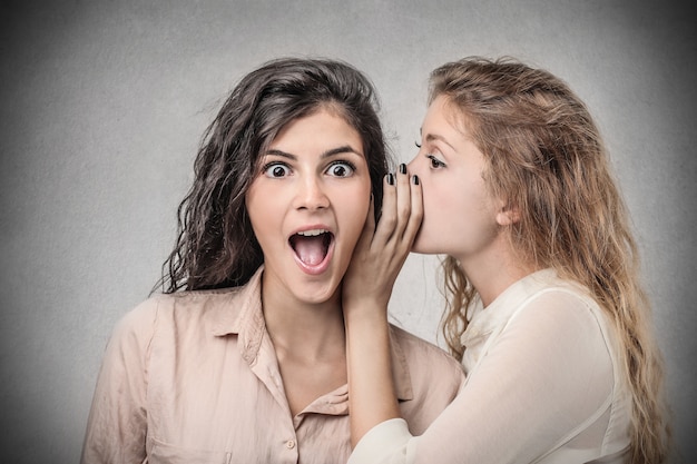 Sharing and telling a secret Premium Photo