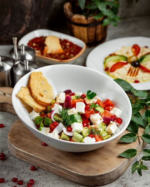 Shepherd Salad Topped With Cheese And Pomegranate Free Photo