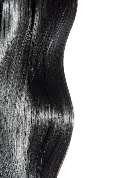 Shiny straight black hair background. beautiful smooth brunette hair Premium Photo