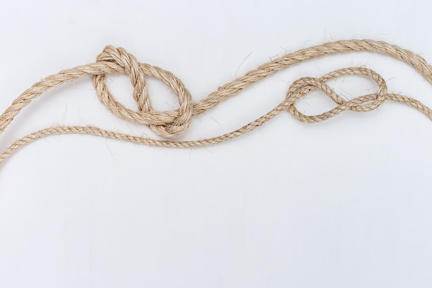 Ship ropes on white wooden background Premium Photo