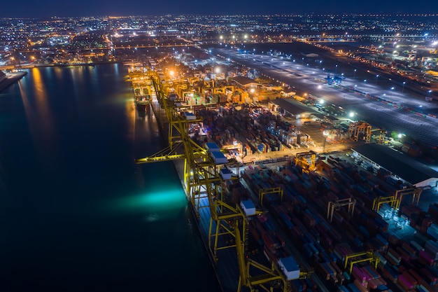 Premium Photo | Shipping port and shipping containers cargo at night ...