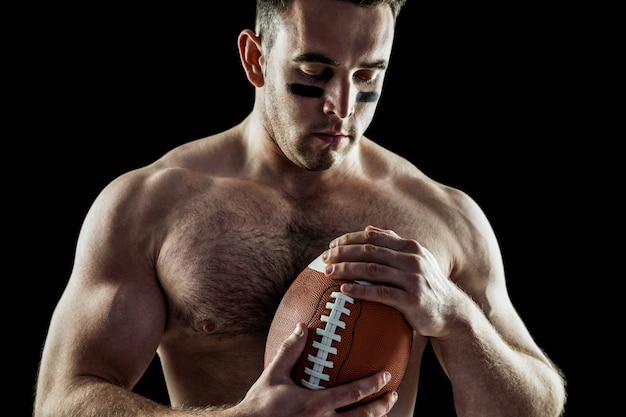 Premium Photo Shirtless American Football Player With Ball