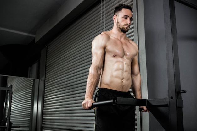 Premium Photo Shirtless Man Doing Pull Up At The Crossfit Gym