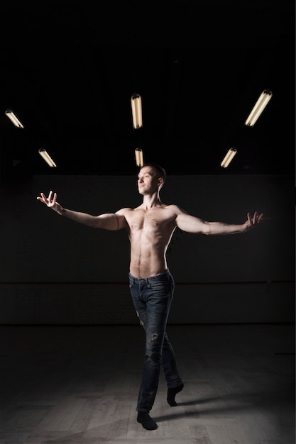 Free Photo Shirtless Man Practicing In Studio